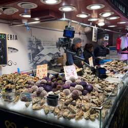 Barcelona markets offer fresh sea urchins (eriçons) & oysters, sourced from Mediterranean & Galicia
