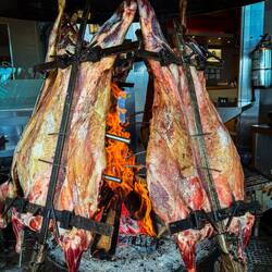 Parilla being prepared at a local restaurant — Ushuaia, Argentina.