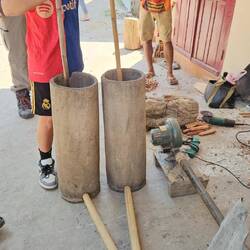 Traditional piston bellows to raise the fire's temperature