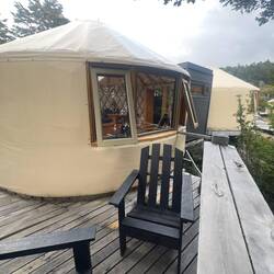 Our two yurt set up with bathroom in the middle.