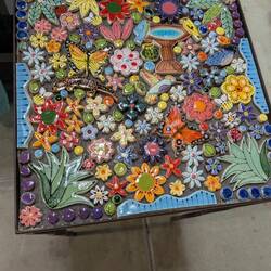 Our creation. 14"x 14" table. They will grout it for us.