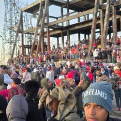 Crowds watching sun rise