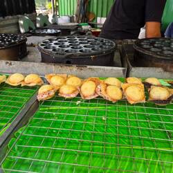 Thai pancakes filled with coconut.