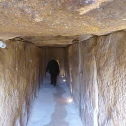 Entrance to Cueva La Viera with massive stone walls and roof
