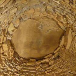 Enormous capstone on corbelled roof
