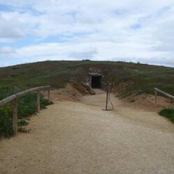 Burial mound with entrance of a dolmen