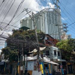 The tall white building is the Novotel