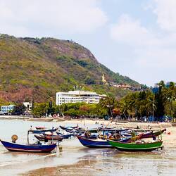 Nice photo with fishing boats and Budda on the hill behind