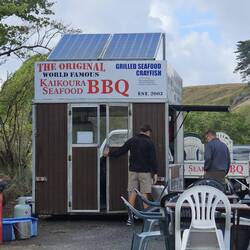 Food truck owner shows Mark his daily catch.
