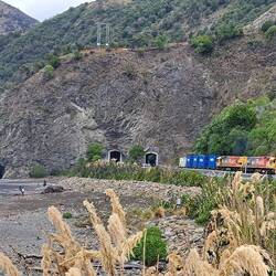 The coastal rail is carved right out of the seaside mtns.