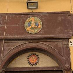 The symbol of Sicily above a door. The 3 legs represent Palermo, Messina, and Siracusa
