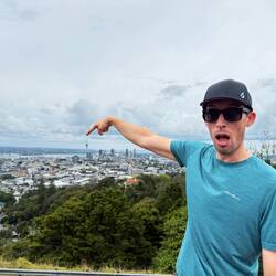 Chris pointing to Auckland sky tower