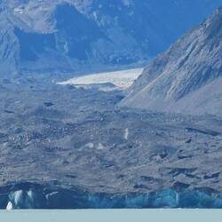 The 'white' parts of the glacier are visible near the top & near the water.