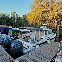 Cat O' Mine snuggled up on A Dock. Big fenders are Good