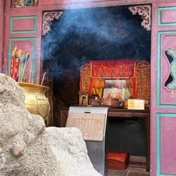 Burning incense at A-Ma Temple
