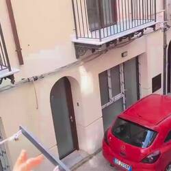 A vegetable vendor making his presence known