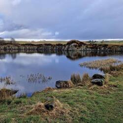 A Roman query for stones. Filled with water to create a lake. Name is Cawfields.