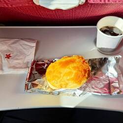 A sweet, delicious, warm, meat-filled pastry and a shot of Coke Zero.