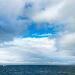 A patch of blue gives us hope that the skies will be clearing — St Andrews Bay, SGI.
