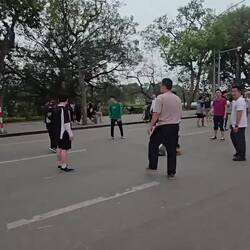 Vietnamese version of hackysack. Small groups lined for blocks playing