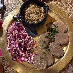 Pork, red cabbage, couscous with nuts and raisins