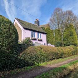 Cute pink canalside cottage seen on our journey