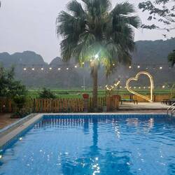 Our pool and view. On a rice field with limestone mountains surrounding us. ♥️