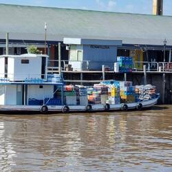 Soft drink and drinking water delivery boat. There are shops on the islands.