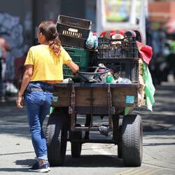 Street vendor with her makeshift car, Medellin.