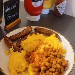 THIS is Austro-German breakfast! Eggs, mini-brats, baked beans & Tabasco sauce.