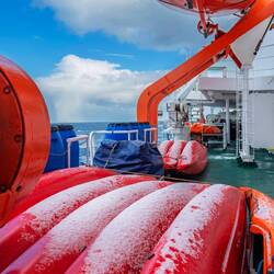 Woke up to snow on deck — heading south through the Scotia Sea.