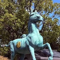 Statue of the horse with emperors gold rosette at the Gokoku shrine