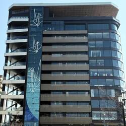 Hiroshima tower building with observation deck; decorated with crane figures, a sign of peace
