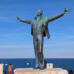 Monument to local boy Domenico Modugno, the singer of "Volare."