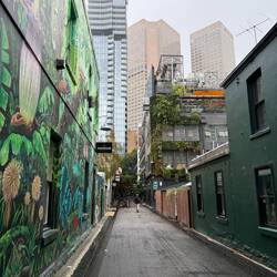 Laneway right by our hotel featuring a rooftop bar on the top right