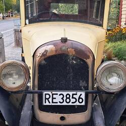 It's a Chrysler! And it's still got a license plate! Doubt it runs though...