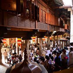 Small crowd on stairs of Temple of Sacred Tooth
