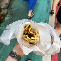 Scallion pancake with Thai basil and egg. Local cost was $50 which equals about $1.50 USD