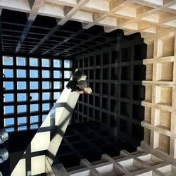 This piece is reflections within motor oil covering this entire room!