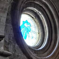 The Camino arrow stained glass window in the church