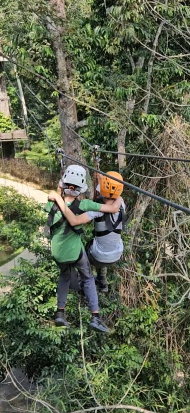 The boys doing a joint zipline.