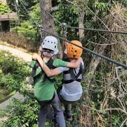 The boys doing a joint zipline.