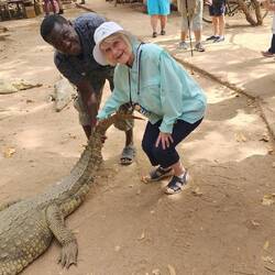Cathy petting a croc!