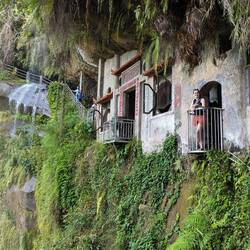 Cave temple and waterfall