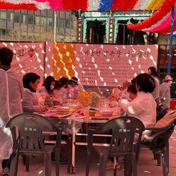 The happy volunteers making the lanterns.