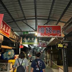 Covered street market that looks like it would be really sketchy but is actually very safe (night)