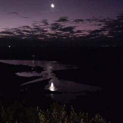 Beautiful reflection in the water of the crescent moon