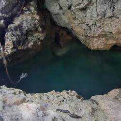 That dark area is water; like the cenotes in Mexico.