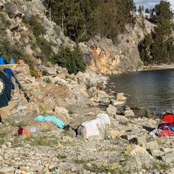 Lady washing clothes in the lake
