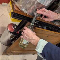 Wine on tap around the corner from our apartment. 2 filled recycled bottles was about 6 Euros